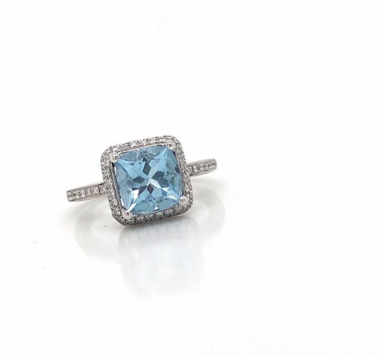 18ct White Gold Diamond and Aquamarine Ring. Set with one Cushion Shaped Aquamarine of 2.64ct and 0.43ct of Round Brilliant Cut Diamonds