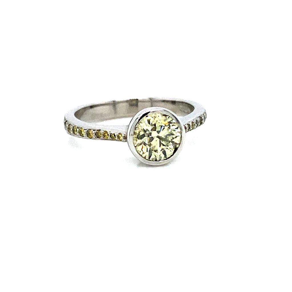 Platinum yellow diamond ring with 1.01ct center, 0.15ct shoulder diamonds