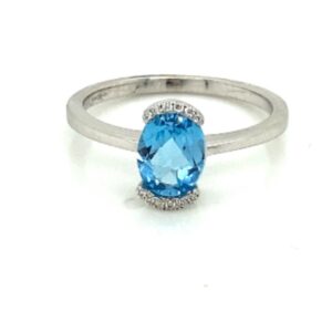 18ct white gold and blue topaz ring with diamond accent